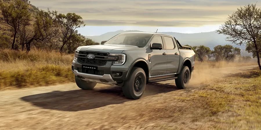 Ford Ranger towing a boat on a coastal highway — Next Level Ranger gallery