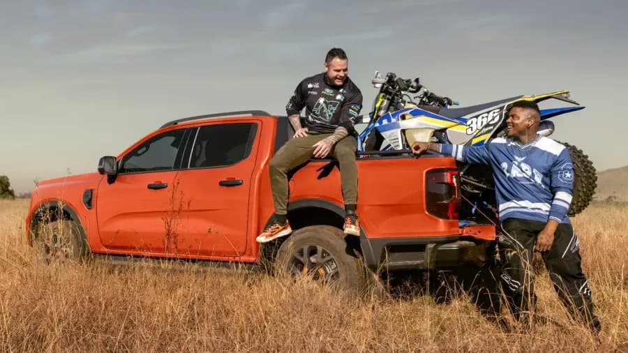 Ford Ranger carrying a dirt bike in a field — Next Level Ranger gallery