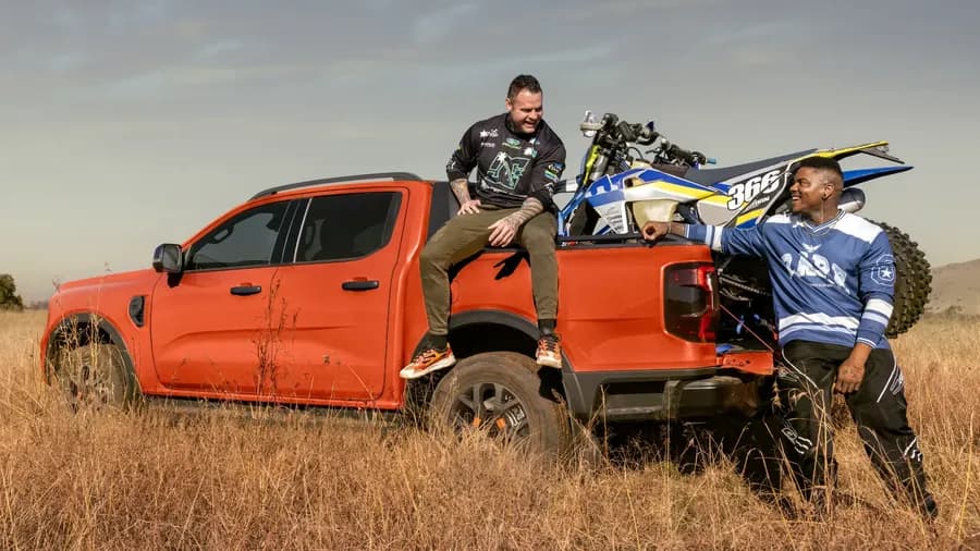 Ford Ranger carrying a dirt bike in a field — Next Level Ranger gallery