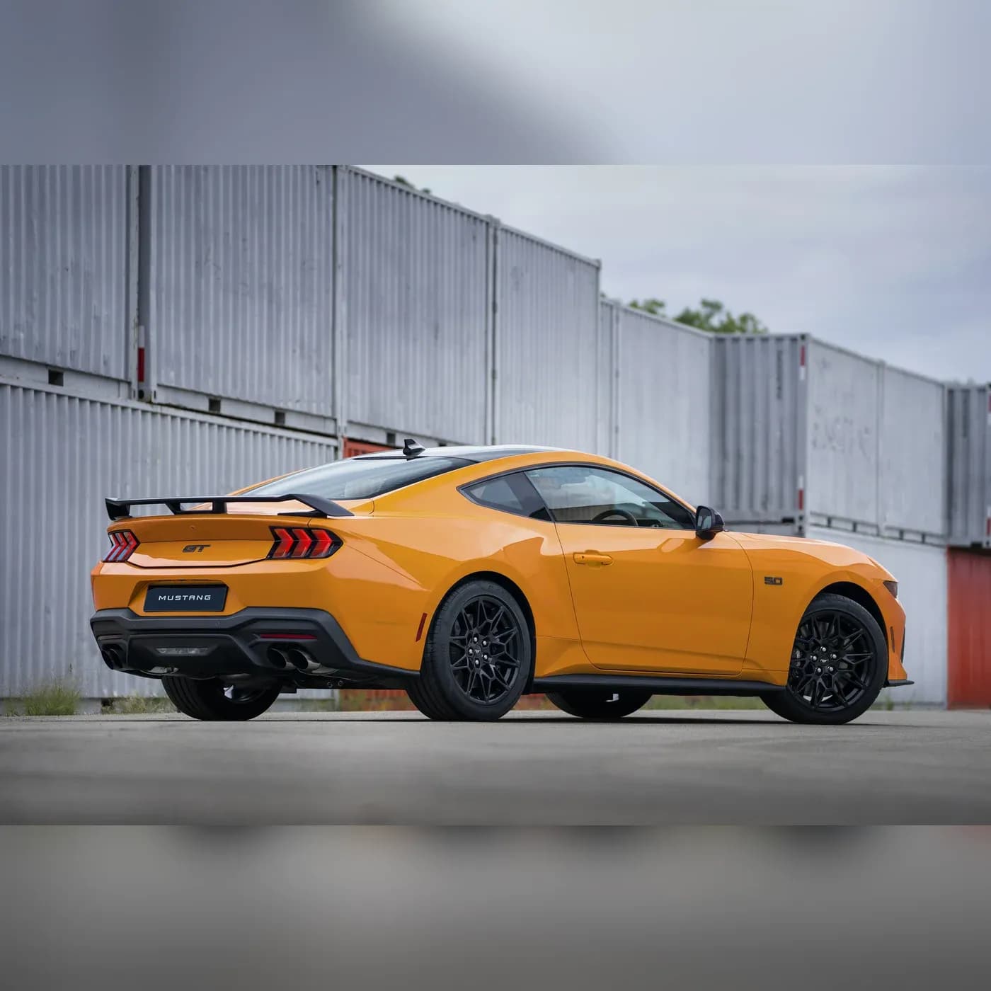 Mustang GT Nite Pony rear three-quarter view in Orange Fury